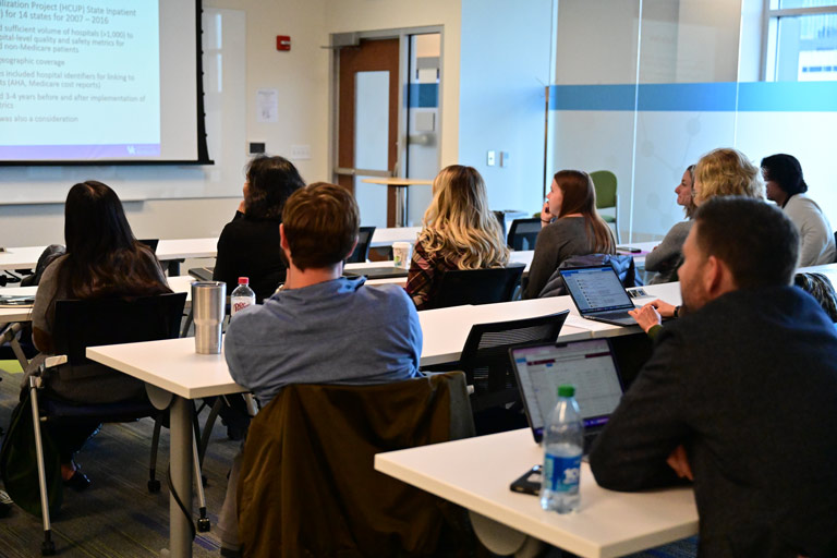 attendees listen during classroom presentation 