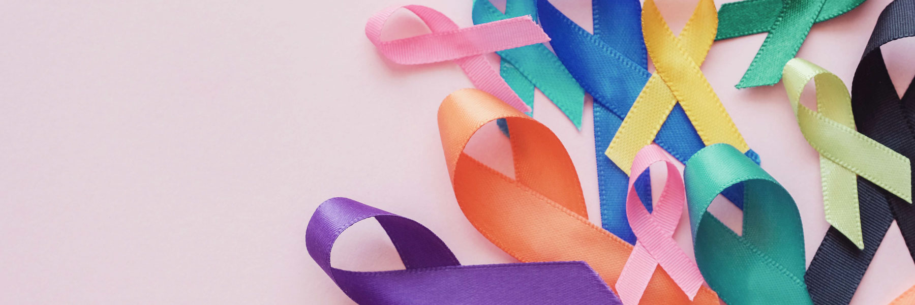 colorful ribbons on a pink background