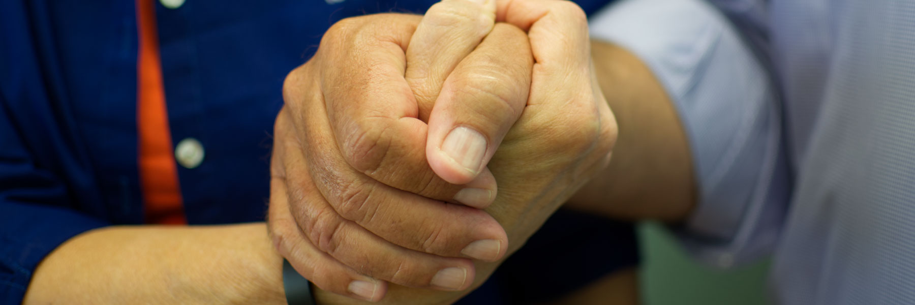 two hands holding together